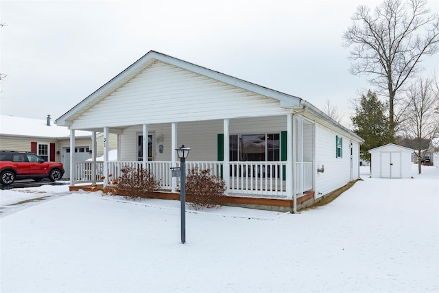 view of front of house with a porch and a storage unit