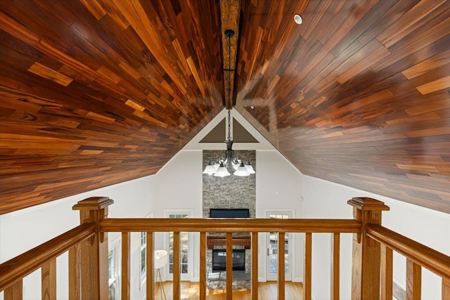 699 Ardsley Rd, Scarsdale, NY 10583 - details featuring a stone fireplace, wooden ceiling, and an inviting chandelier