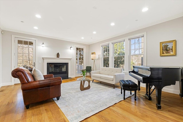 699 Ardsley Rd, Scarsdale, NY 10583 - living area with plenty of natural light, recessed lighting, light wood-style floors, and crown molding