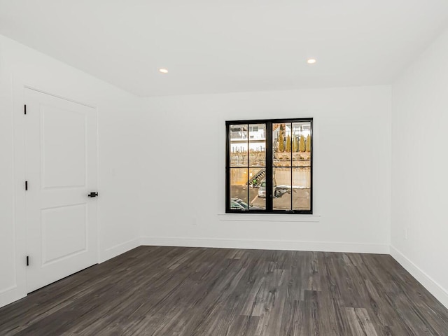 unfurnished room featuring dark hardwood / wood-style floors