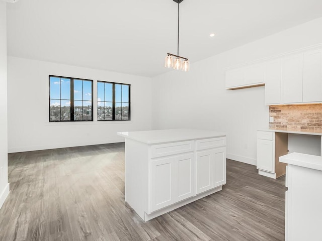 interior space with built in desk and light hardwood / wood-style flooring