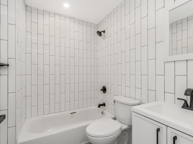 full bathroom featuring vanity, tile walls, toilet, and tiled shower / bath