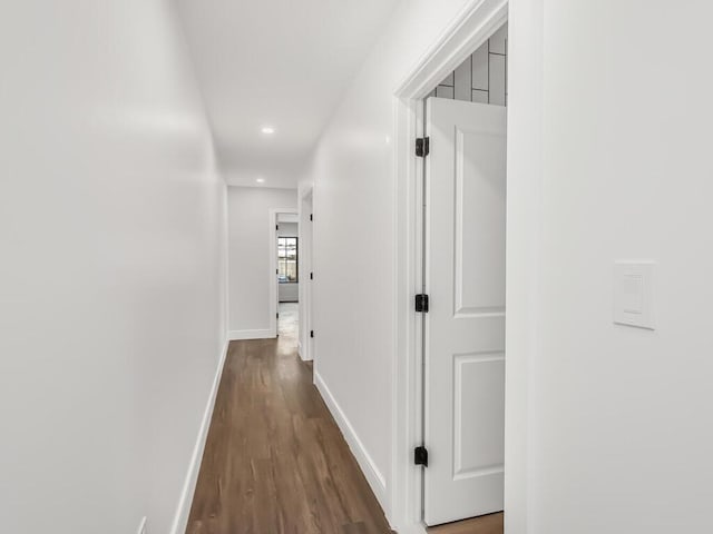 hallway with dark wood-type flooring