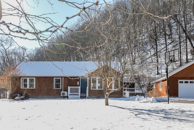 view of snow covered rear of property