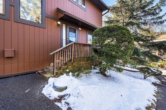 view of snow covered property entrance