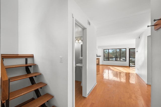 corridor featuring light hardwood / wood-style flooring