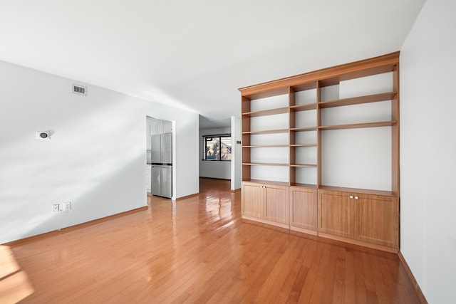 unfurnished living room featuring light hardwood / wood-style floors