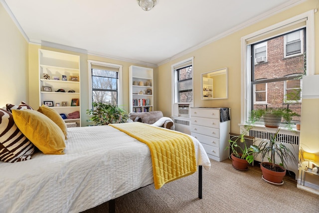 carpeted bedroom with multiple windows, crown molding, and radiator heating unit