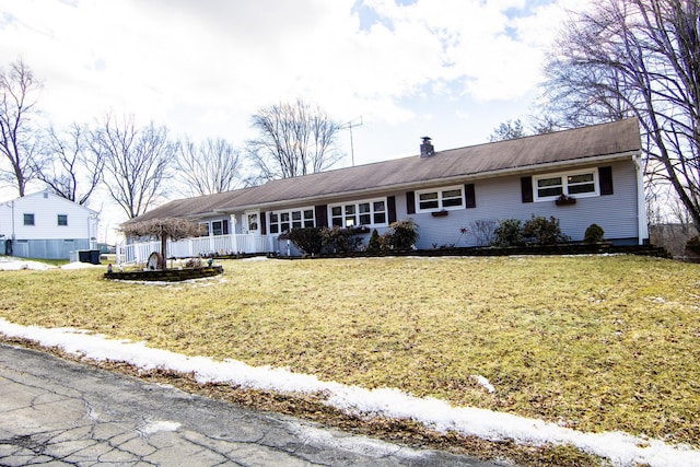 ranch-style home with a front lawn