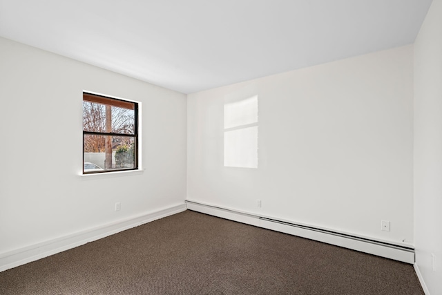 unfurnished room with baseboard heating and carpet flooring