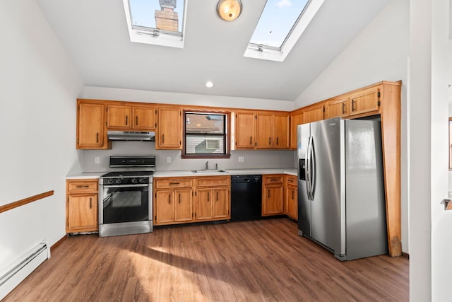 kitchen featuring lofted ceiling with skylight, gas stove, stainless steel fridge with ice dispenser, black dishwasher, and a baseboard heating unit