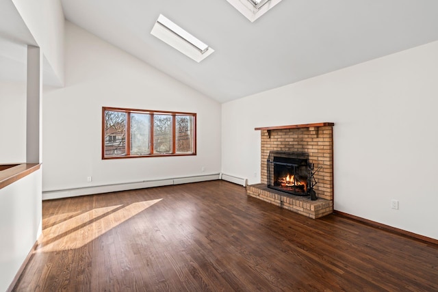 unfurnished living room with hardwood / wood-style flooring, a baseboard heating unit, a skylight, high vaulted ceiling, and a brick fireplace