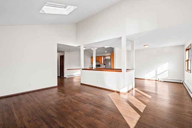 unfurnished living room featuring baseboard heating, high vaulted ceiling, a skylight, and hardwood / wood-style floors