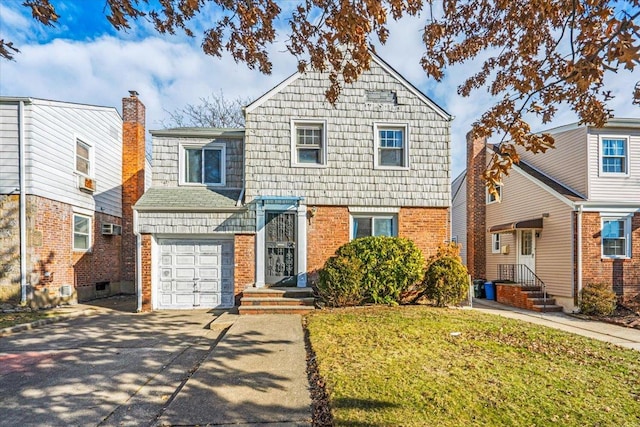 view of property with a garage and a front yard