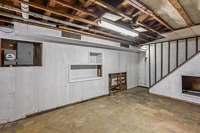 basement featuring electric panel