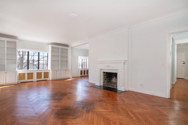 unfurnished living room featuring dark parquet flooring and ornamental molding