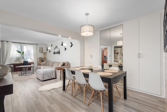 dining space featuring light hardwood / wood-style flooring