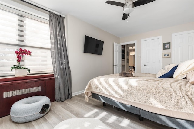 bedroom featuring ceiling fan and light wood-type flooring