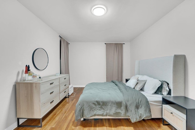 bedroom with light hardwood / wood-style flooring