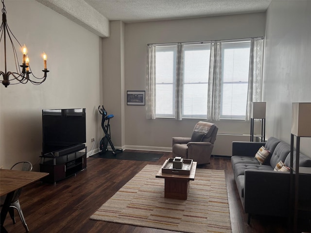 1 Landmark Sq Unit 302, Port Chester, NY 10573 - living room with a notable chandelier, dark wood-type flooring, and a textured ceiling