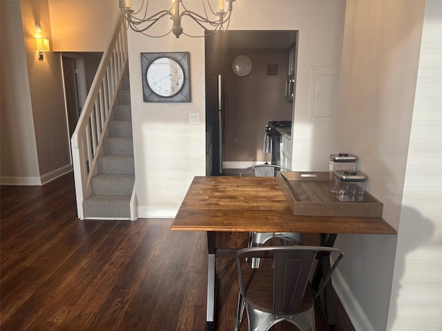 1 Landmark Sq Unit 302, Port Chester, NY 10573 - dining room featuring a notable chandelier and dark hardwood / wood-style flooring