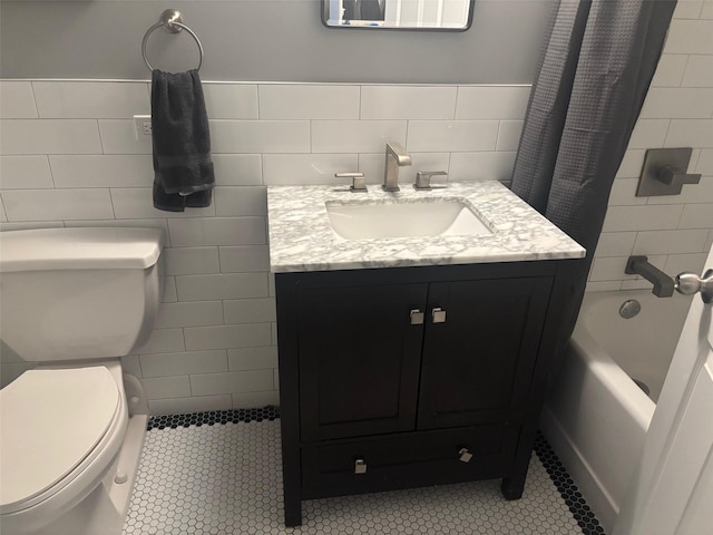 1 Landmark Sq Unit 302, Port Chester, NY 10573 - full bathroom with tile walls, vanity, toilet, shower / bath combo, and tile patterned floors