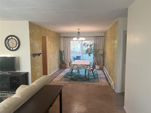 dining space with an inviting chandelier and a baseboard heating unit