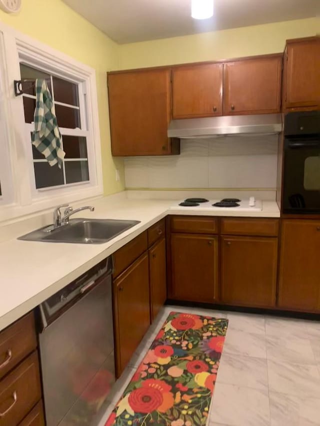 kitchen with sink, black oven, white cooktop, and dishwasher