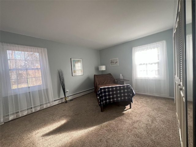 carpeted bedroom with a baseboard radiator