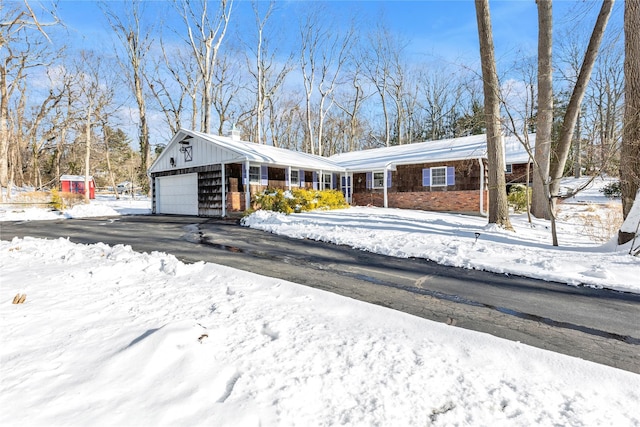 single story home with an outbuilding and a garage