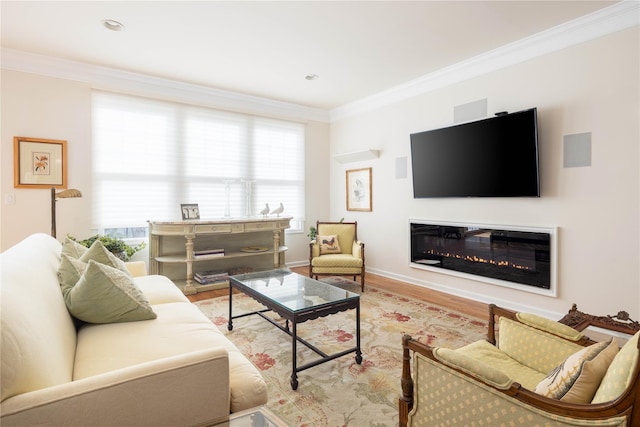 living room with crown molding, a wealth of natural light, and light wood-type flooring