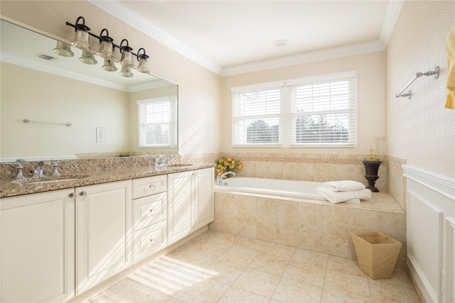 bathroom with ornamental molding, a relaxing tiled tub, vanity, and tile patterned floors