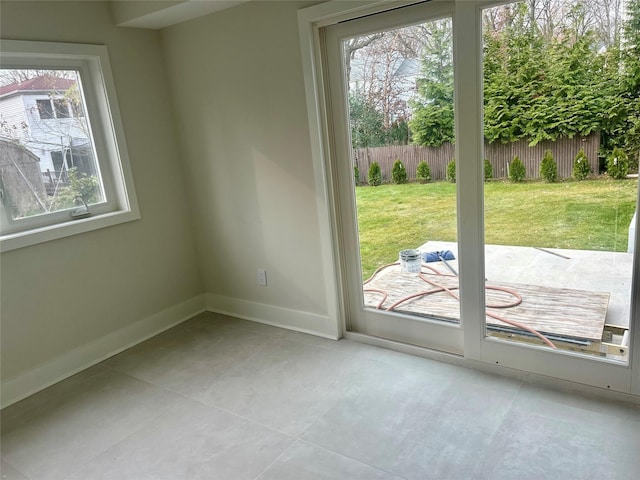 entryway featuring plenty of natural light and light tile patterned flooring