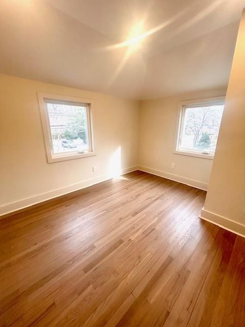 bonus room featuring hardwood / wood-style flooring and lofted ceiling