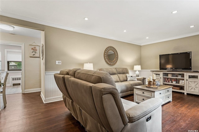 living room with crown molding, dark hardwood / wood-style floors, and radiator heating unit