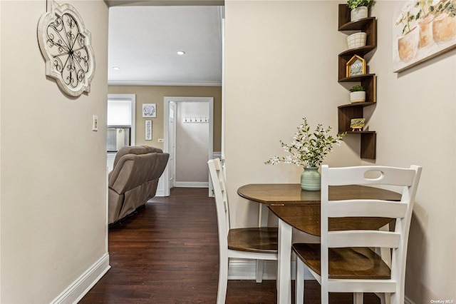 dining space with dark hardwood / wood-style floors