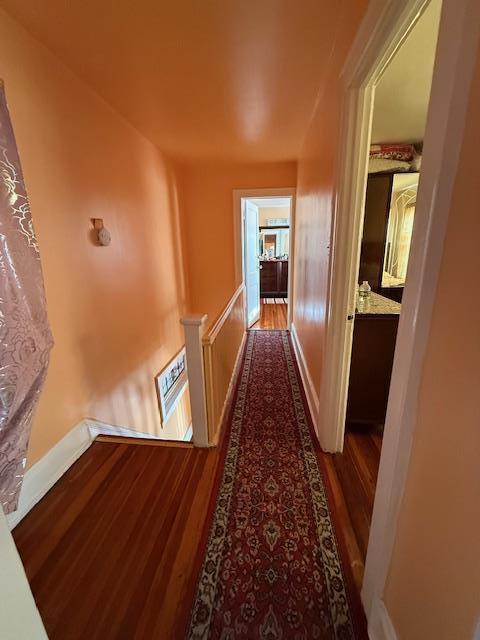 hallway featuring dark hardwood / wood-style flooring