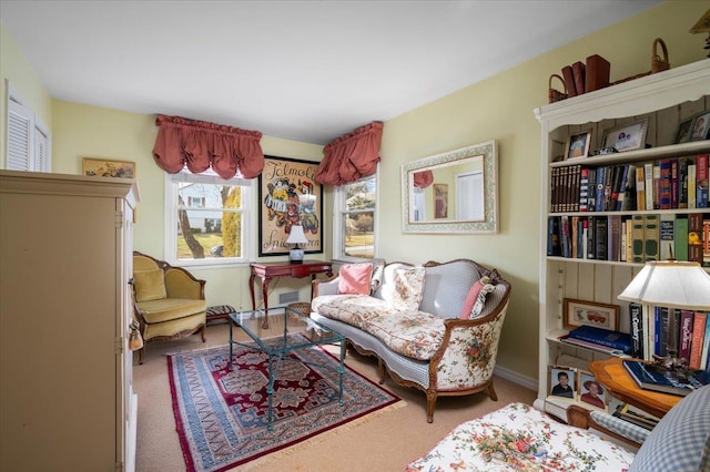 living area featuring carpet floors