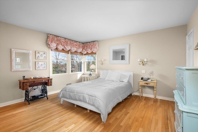 bedroom with light hardwood / wood-style floors