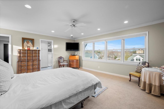 carpeted bedroom featuring ceiling fan and ornamental molding