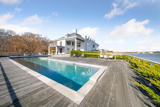 view of pool with a water view