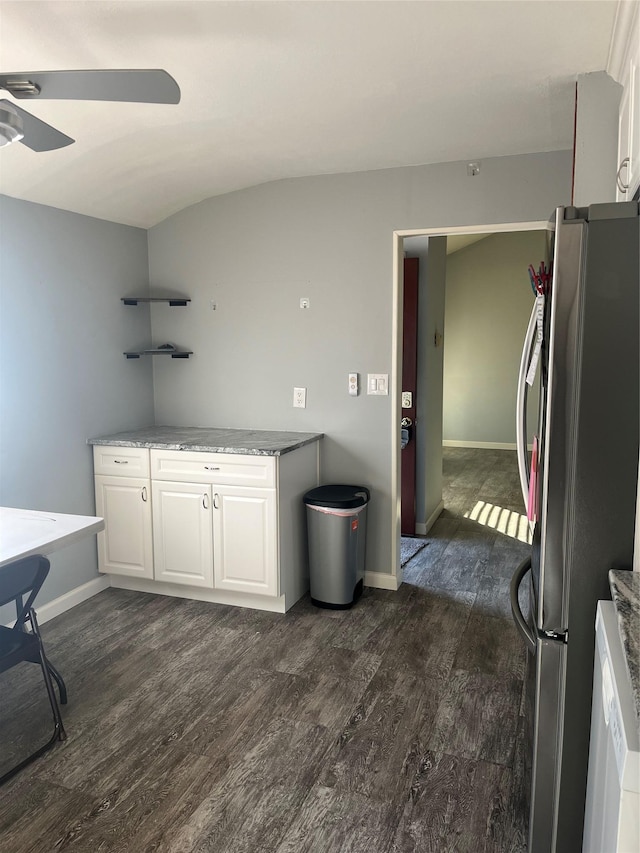 kitchen featuring white cabinetry, ceiling fan, stainless steel fridge, and dark hardwood / wood-style flooring