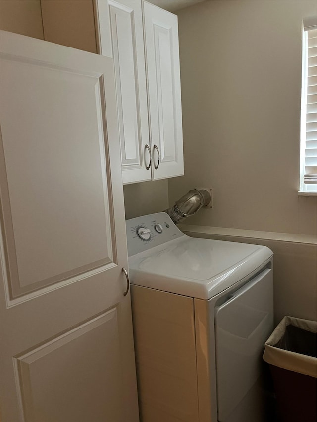 laundry room with washer / clothes dryer and cabinets