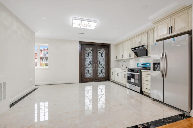 kitchen featuring sink, crown molding, appliances with stainless steel finishes, cream cabinetry, and backsplash