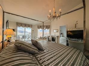 carpeted bedroom with a chandelier