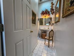 hallway featuring light tile patterned floors