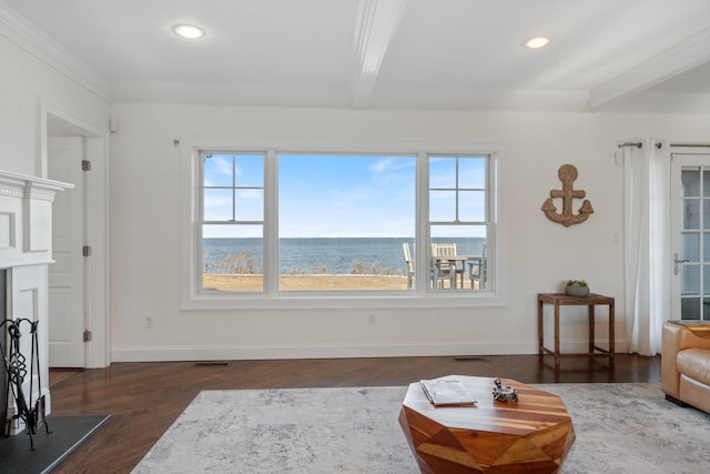 living room featuring a water view, dark wood-type flooring, and beam ceiling