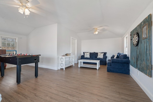 playroom featuring lofted ceiling, hardwood / wood-style floors, and ceiling fan