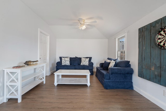 living room with lofted ceiling, dark hardwood / wood-style flooring, and ceiling fan