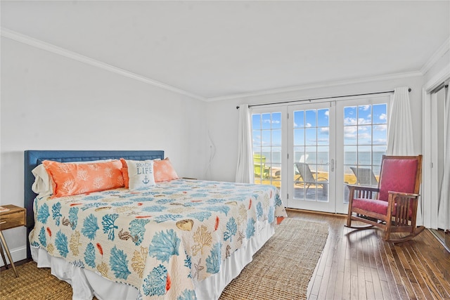 bedroom featuring access to exterior, crown molding, and hardwood / wood-style flooring